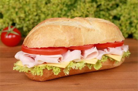 Fresh sub with ham, tomatoes, lettuce and cheese Stock Photo - Budget Royalty-Free & Subscription, Code: 400-06328460