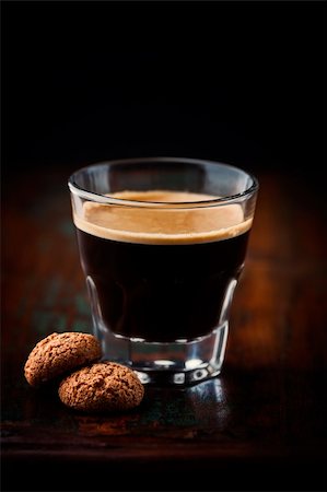 glass of espresso and biscotti on dark wooden background Stock Photo - Budget Royalty-Free & Subscription, Code: 400-06328643