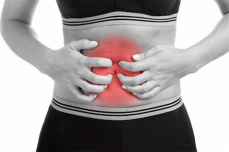 simsearch:400-06106822,k - Woman suffering from stomach pain. Black and White with a red spot around the painful area Stockbilder - Microstock & Abonnement, Bildnummer: 400-06328682