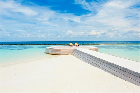 simsearch:400-04893796,k - Two deck chairs on the wooden footpath in the Maldives Foto de stock - Super Valor sin royalties y Suscripción, Código: 400-06328723