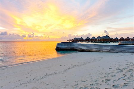 simsearch:400-05742448,k - Beautiful vivid sunset over beach with the water villas in the Indian ocean, Maldives Stock Photo - Budget Royalty-Free & Subscription, Code: 400-06328731