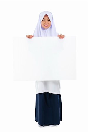 Fullbody Southeast Asian teen holding a blank card board over white background Stock Photo - Budget Royalty-Free & Subscription, Code: 400-06328846