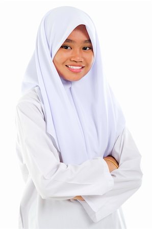 simsearch:400-06142860,k - Portrait of a Southeast Asian Muslim teen crossed arms over white background Fotografie stock - Microstock e Abbonamento, Codice: 400-06328853