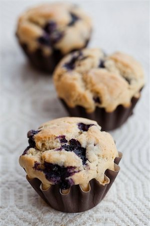 simsearch:400-07034479,k - Close-up on delicious and healthy home-made blueberry muffins Stock Photo - Budget Royalty-Free & Subscription, Code: 400-06328907