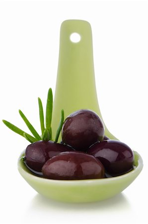 eating olive - Olives on ceramic spoon with basil and olive oil Stock Photo - Budget Royalty-Free & Subscription, Code: 400-06329050