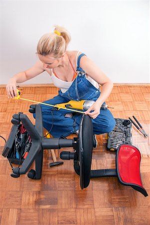 Young girl prepairs to repair broken plastic chair Stock Photo - Budget Royalty-Free & Subscription, Code: 400-06329339