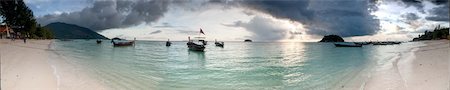 Wide angle panorama of the sunrise on a tropical beach Stock Photo - Budget Royalty-Free & Subscription, Code: 400-06329510