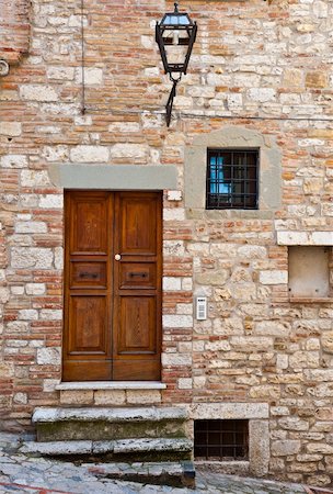 Wooden Ancient Italian Door in Historic Center Stock Photo - Budget Royalty-Free & Subscription, Code: 400-06329649