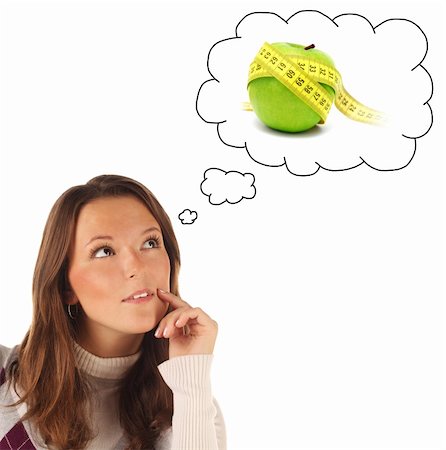 Close-up portrait of girl dreaming about healthy food isolated on white background Photographie de stock - Aubaine LD & Abonnement, Code: 400-06329675