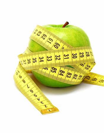 Green apple and measuring tape isolated on white background Photographie de stock - Aubaine LD & Abonnement, Code: 400-06329671