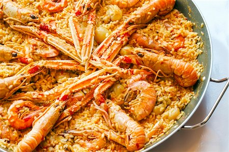 paella - traditional spanish paella with prawn on big pan Foto de stock - Super Valor sin royalties y Suscripción, Código: 400-06329753