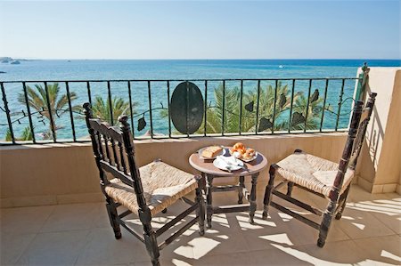 Tropical sea view from a luxury hotel balcony Stock Photo - Budget Royalty-Free & Subscription, Code: 400-06330393