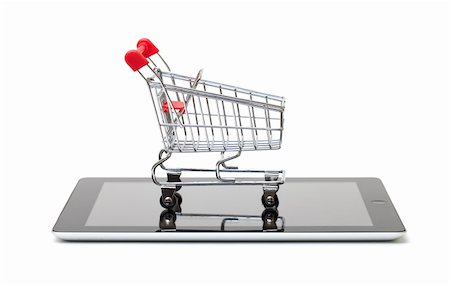 simsearch:400-06484373,k - Shopping Cart over a Tablet PC on white background Stock Photo - Budget Royalty-Free & Subscription, Code: 400-06330479