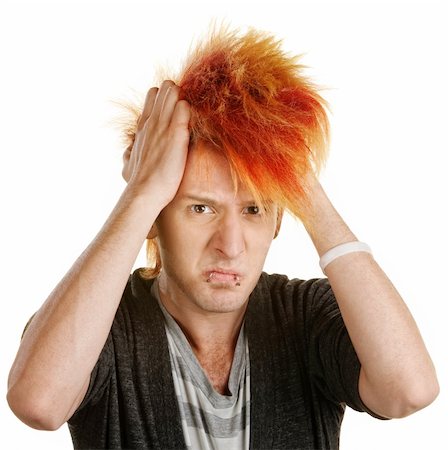 simsearch:400-06365837,k - Frustrated male teenager in mohawk pulling his hair Stockbilder - Microstock & Abonnement, Bildnummer: 400-06330526