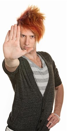 Teenage male in orange mohawk with hand in front Photographie de stock - Aubaine LD & Abonnement, Code: 400-06330529