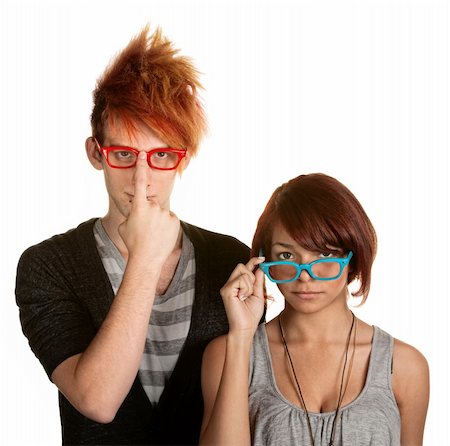 simsearch:400-06330521,k - Awkward male and female teenager adjusting their glasses Photographie de stock - Aubaine LD & Abonnement, Code: 400-06330536