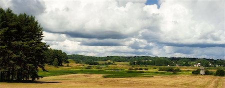 Rural landscape with old mill, thick clouds and the field Stock Photo - Budget Royalty-Free & Subscription, Code: 400-06330573