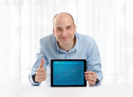 simsearch:628-05817598,k - Man showing growth graph on a digital tablet Stockbilder - Microstock & Abonnement, Bildnummer: 400-06330694