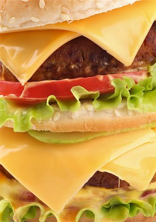 simsearch:400-06330800,k - Tasty Double Cheeseburger with beef, tomato, letucce and cheese closeup Stock Photo - Budget Royalty-Free & Subscription, Code: 400-06330800