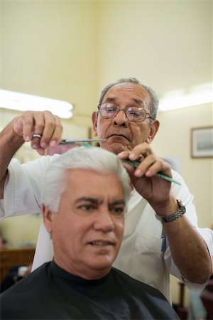 Active retired old people, man getting an haircut by senior barber in old fashion barber's shop. Copy space Stock Photo - Budget Royalty-Free & Subscription, Code: 400-06330959