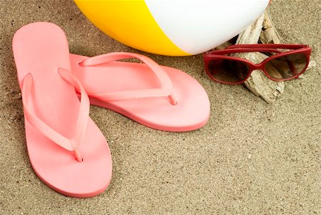 Flip-Flops, beach ball and sunglasses on the beach Stock Photo - Budget Royalty-Free & Subscription, Code: 400-06330982
