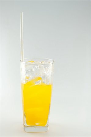 a glass of orange juice on white background Photographie de stock - Aubaine LD & Abonnement, Code: 400-06331235