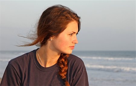 Teenage girl looking out toward the ocean.` Stockbilder - Microstock & Abonnement, Bildnummer: 400-06331725