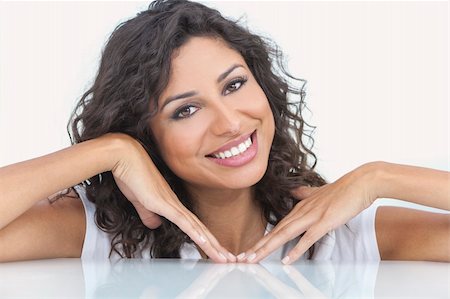 simsearch:400-07112758,k - Studio portrait of a beautiful young Latina Hispanic woman smiling Fotografie stock - Microstock e Abbonamento, Codice: 400-06332111