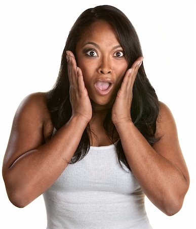 Surprised athletic African woman with hands on face Stock Photo - Budget Royalty-Free & Subscription, Code: 400-06332204