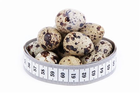 quail eggs and measuring tape isolated over white background Foto de stock - Super Valor sin royalties y Suscripción, Código: 400-06332281