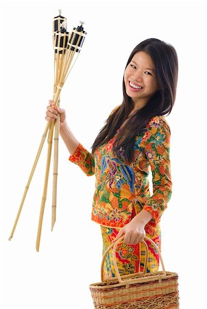 Happy young Malay woman ready to celebrate Hari Raya Aidilfitri / Eid ul-Fitr Foto de stock - Super Valor sin royalties y Suscripción, Código: 400-06332641