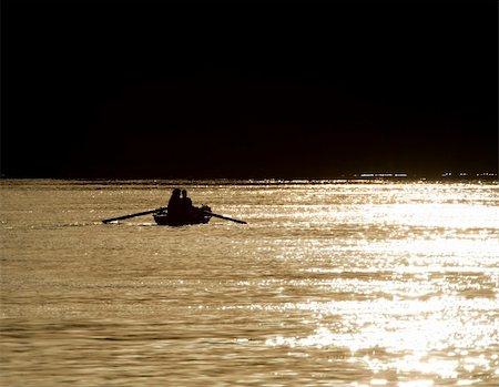 Traditional nubian fishermen on the River Nile silhouetted in the sunset Fotografie stock - Microstock e Abbonamento, Codice: 400-06333405