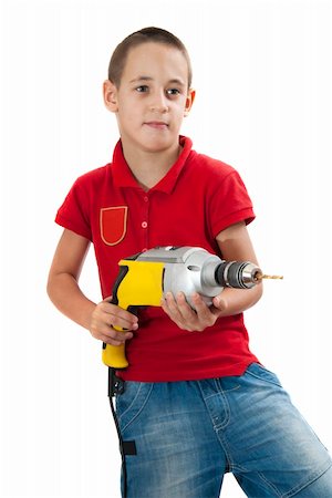 Cute boy posing with drill in his hands, isolated on white Stock Photo - Budget Royalty-Free & Subscription, Code: 400-06333435