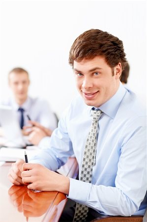 simsearch:400-05669026,k - Young businessman in office Stock Photo - Budget Royalty-Free & Subscription, Code: 400-06355529