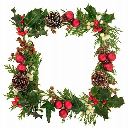 simsearch:400-06356099,k - Christmas decorative border of holly, ivy, mistletoe, cedar leaf sprigs with pine cones and red baubles over white background. Stock Photo - Budget Royalty-Free & Subscription, Code: 400-06356079