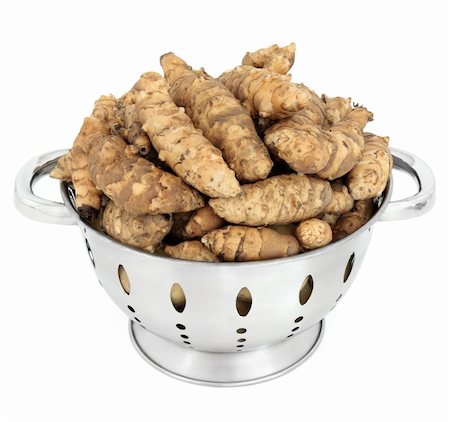 Jerusalem artichoke raw vegetables in a stainless steel colander over white background. Foto de stock - Super Valor sin royalties y Suscripción, Código: 400-06356855