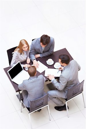 simsearch:400-05669026,k - Businessmen discussing in the office Stock Photo - Budget Royalty-Free & Subscription, Code: 400-06357761