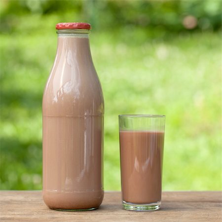Fresh chocolate drink in a bottle and in a glass with a green background Stock Photo - Budget Royalty-Free & Subscription, Code: 400-06358767