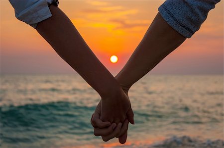 Closeup of a Hands of a Couple Held Together Fotografie stock - Microstock e Abbonamento, Codice: 400-06359307