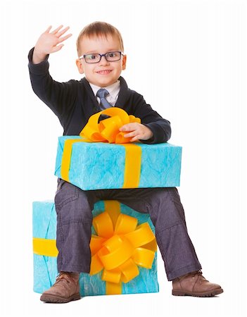 event miniature photography - Small boy in spectacles with big present on white background Stock Photo - Budget Royalty-Free & Subscription, Code: 400-06359775