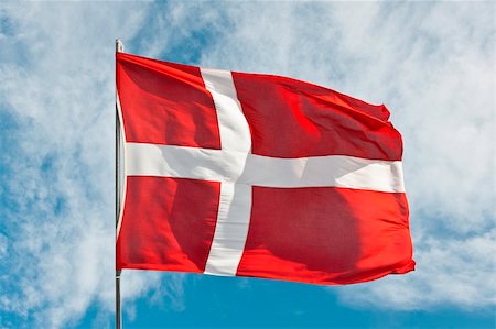 National flag of denmark flying in the wind against a summer sky Fotografie stock - Microstock e Abbonamento, Codice: 400-06364037