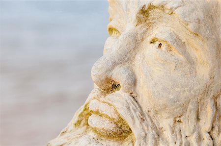 Face of mythological god Neptune with water on background Stockbilder - Microstock & Abonnement, Bildnummer: 400-06364074