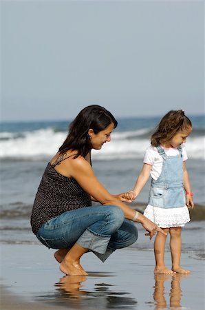 pregnant woman walking on beach - Mother and daughter together at the beach. The mother is expecting an other child. Stock Photo - Budget Royalty-Free & Subscription, Code: 400-06364357