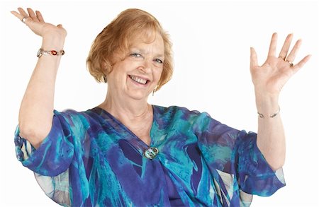 Easy going senior woman with hands up smiling Stock Photo - Budget Royalty-Free & Subscription, Code: 400-06365844