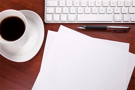 cup of coffee keyboard piece of paper and pen on the table Stock Photo - Budget Royalty-Free & Subscription, Code: 400-06365847