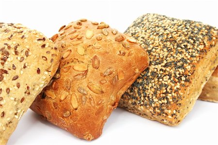 people eating bagels - Breads with different seeds isolated on white background. Photographie de stock - Aubaine LD & Abonnement, Code: 400-06365932