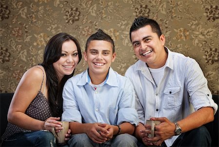 simsearch:400-06366240,k - Joyful Native American family sitting together indoors Stockbilder - Microstock & Abonnement, Bildnummer: 400-06366241