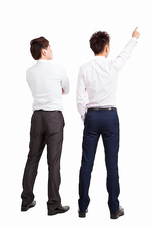 full length of two businessman pointing and looking Stock Photo - Budget Royalty-Free & Subscription, Code: 400-06367545