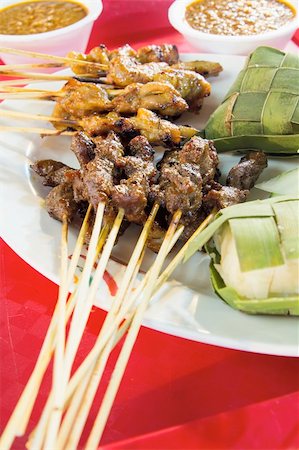 satay - Chicken Beef and Mutton Satay with Ketupat and Peanut Gravy Sauce Stock Photo - Budget Royalty-Free & Subscription, Code: 400-06360393