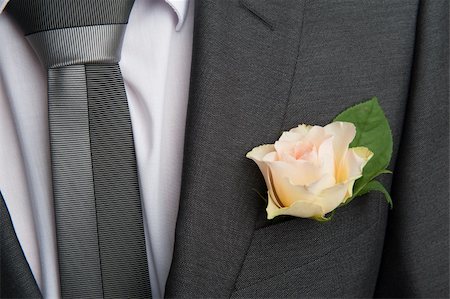 rose boutonniere flower on groom's wedding coat Foto de stock - Super Valor sin royalties y Suscripción, Código: 400-06360526